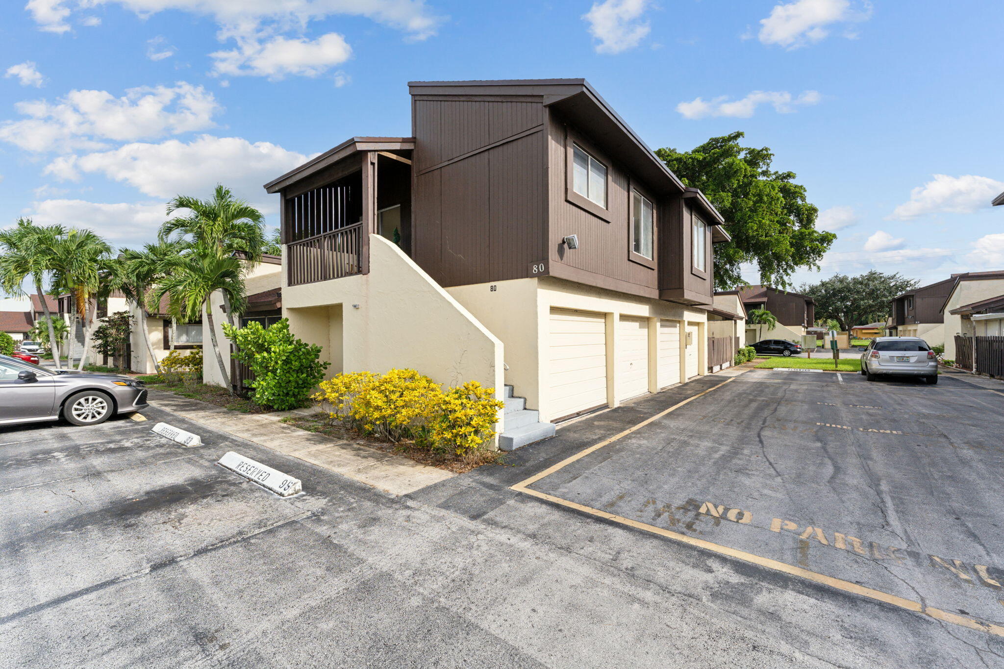 5312 Bosque Lane, Unit 80 West Palm Beach, FL 33415 - Photo 16 of 20 a car parked in front of a house
