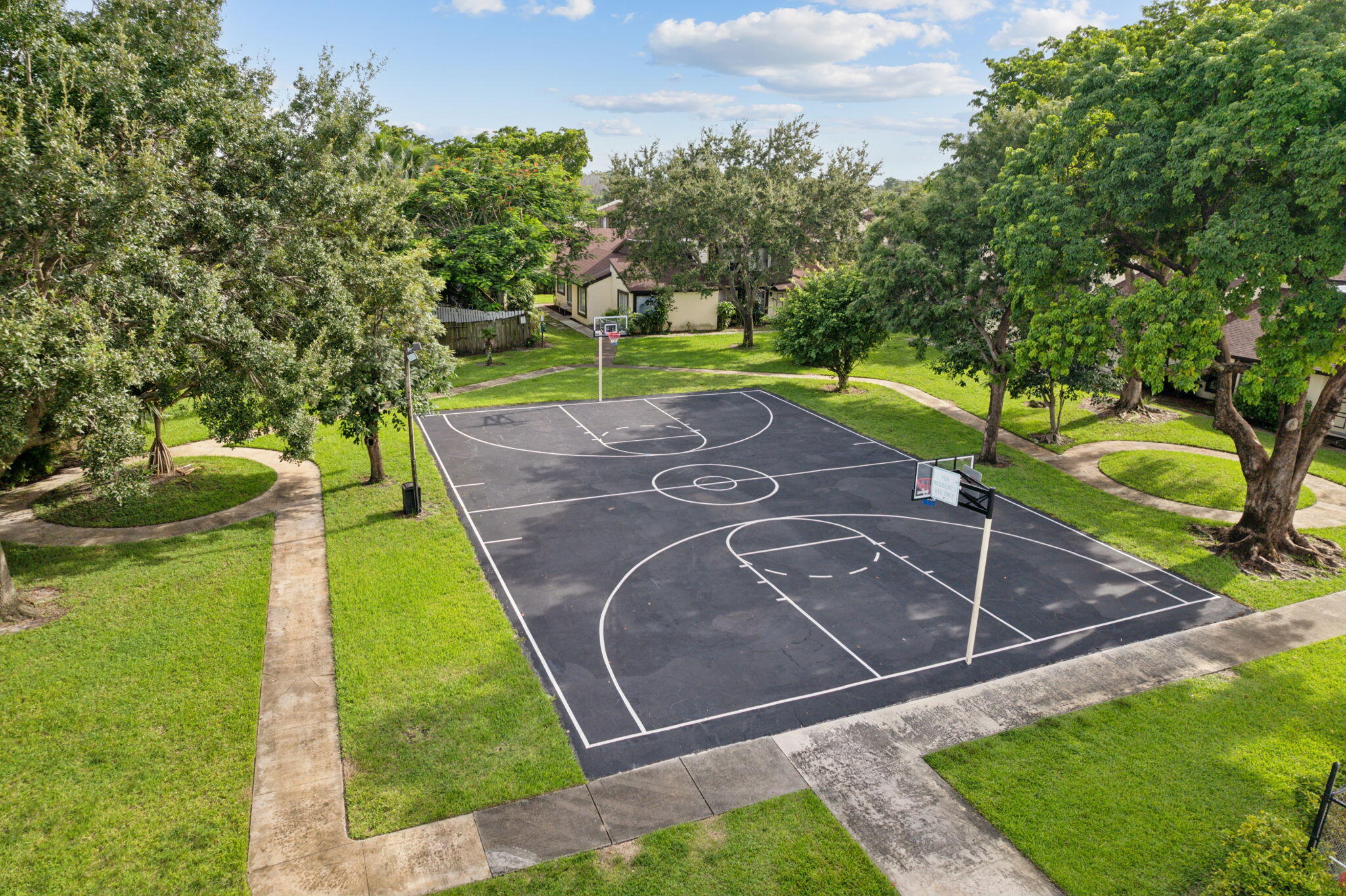 5312 Bosque Lane, Unit 80 West Palm Beach, FL 33415 - Photo 20 of 20 a view of a backyard with swimming pool