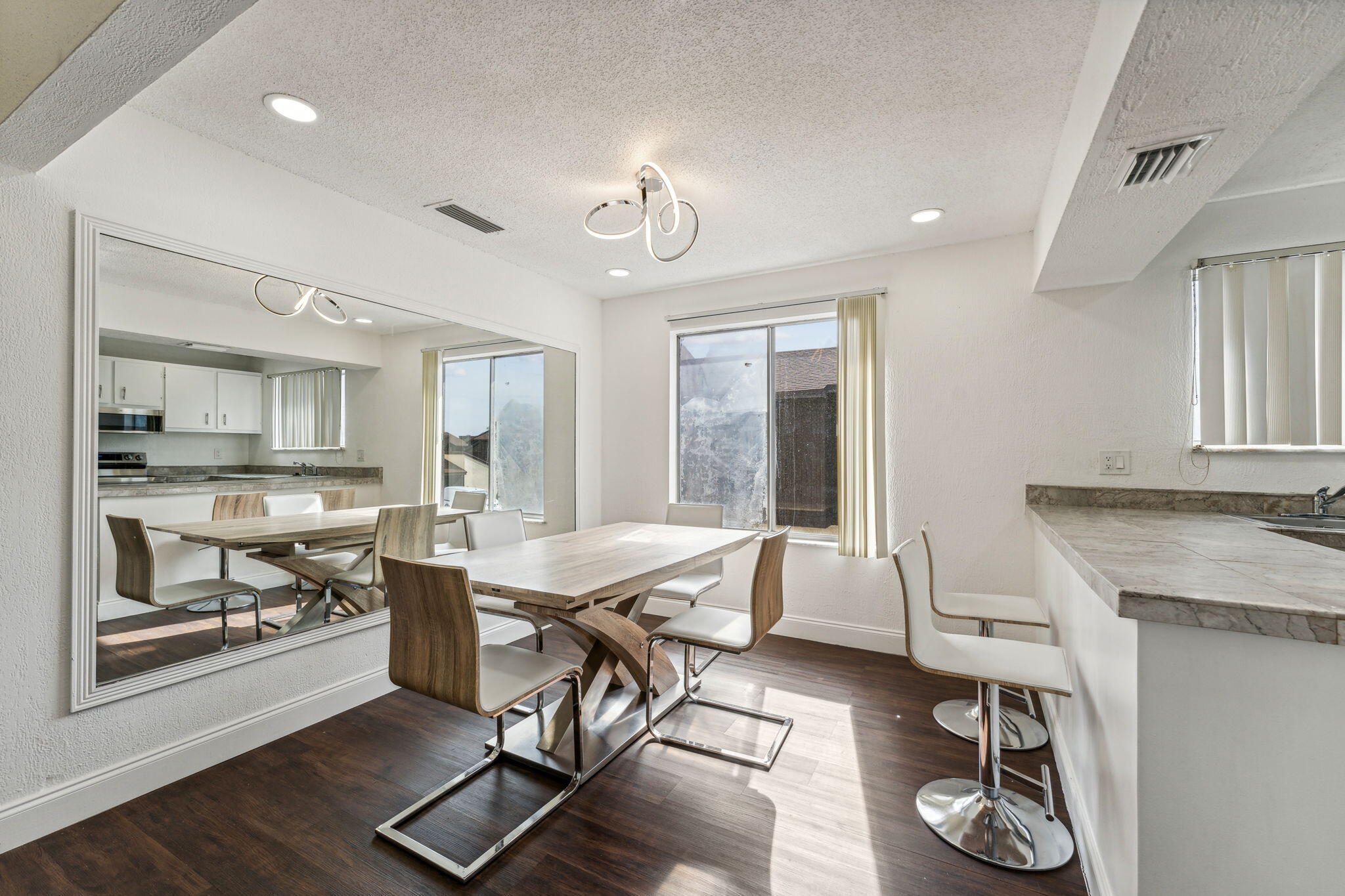 5312 Bosque Lane, Unit 80 West Palm Beach, FL 33415 - Photo 2 of 20 a living room with furniture a table and kitchen view