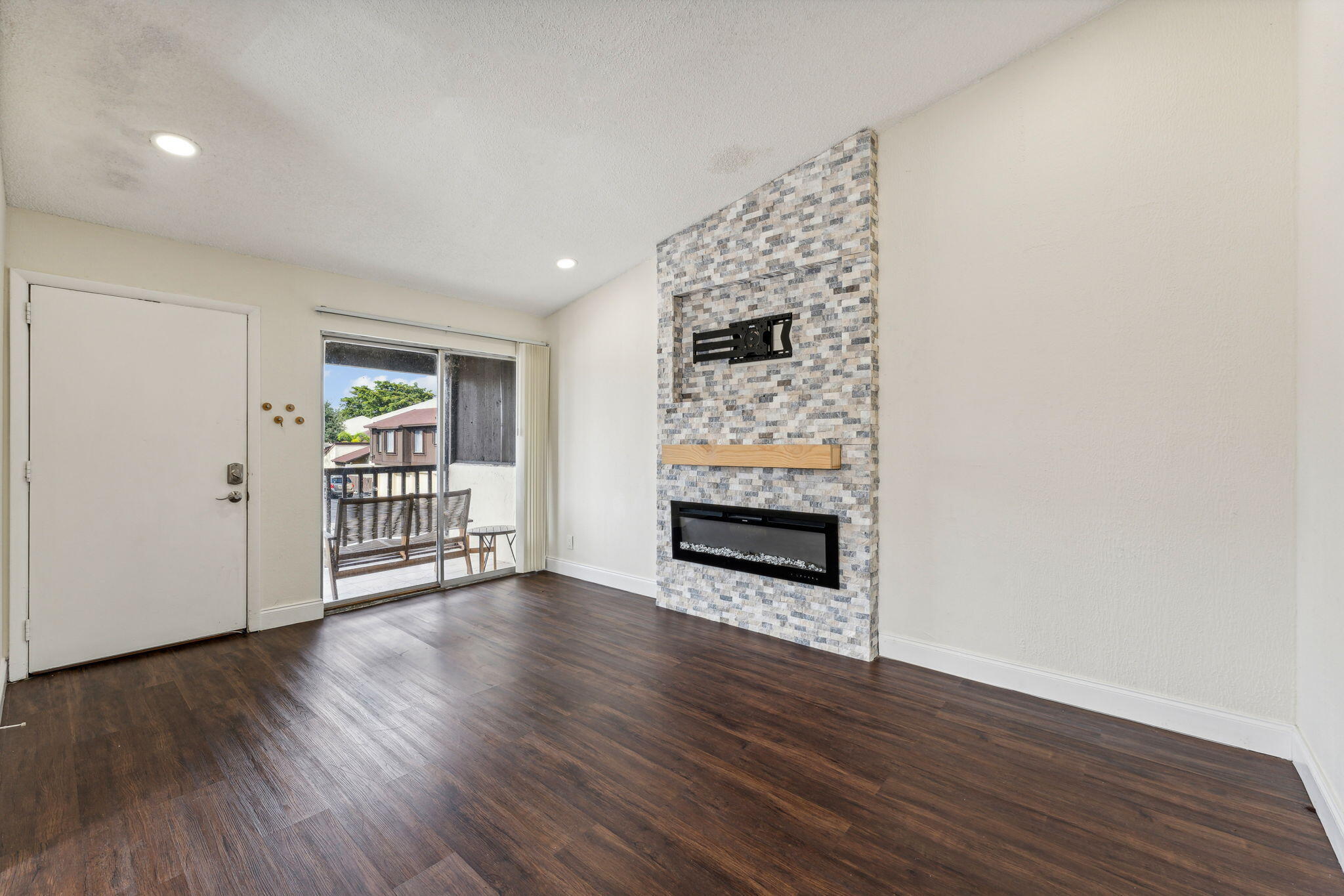 5312 Bosque Lane, Unit 80 West Palm Beach, FL 33415 - Photo 8 of 20 a view of empty room with wooden floor and fan