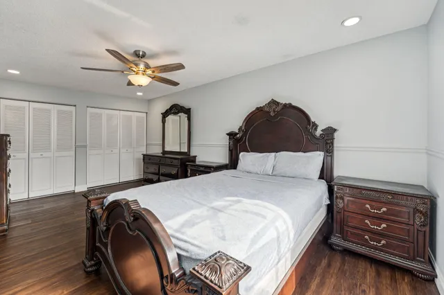 a bedroom with a bed and a closet