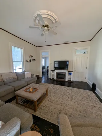 a bedroom with a bed and a television