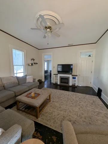 a bedroom with a bed and a television