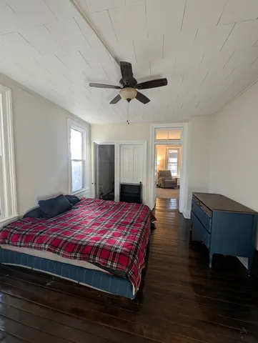 a living room filled with furniture and a large window