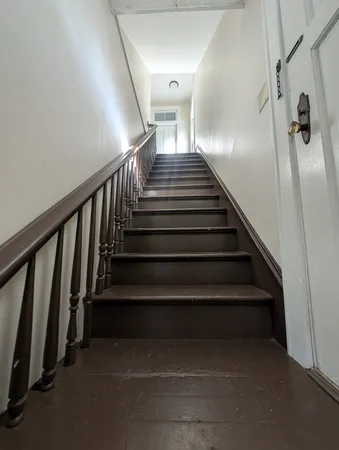 an empty room with staircase