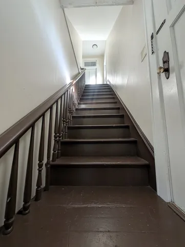 an empty room with staircase