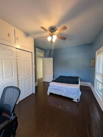 a bedroom with a bed and a walk in closet