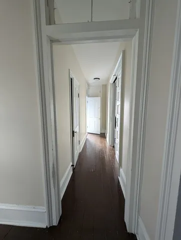 a bedroom with a large bed and a tv