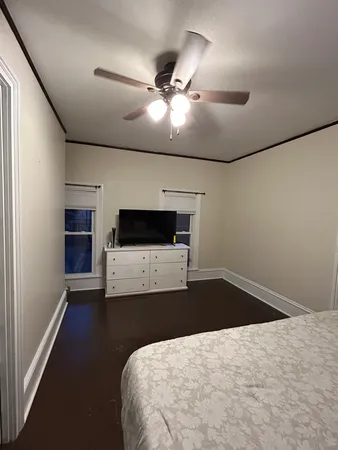 a bathroom with a sink toilet and window