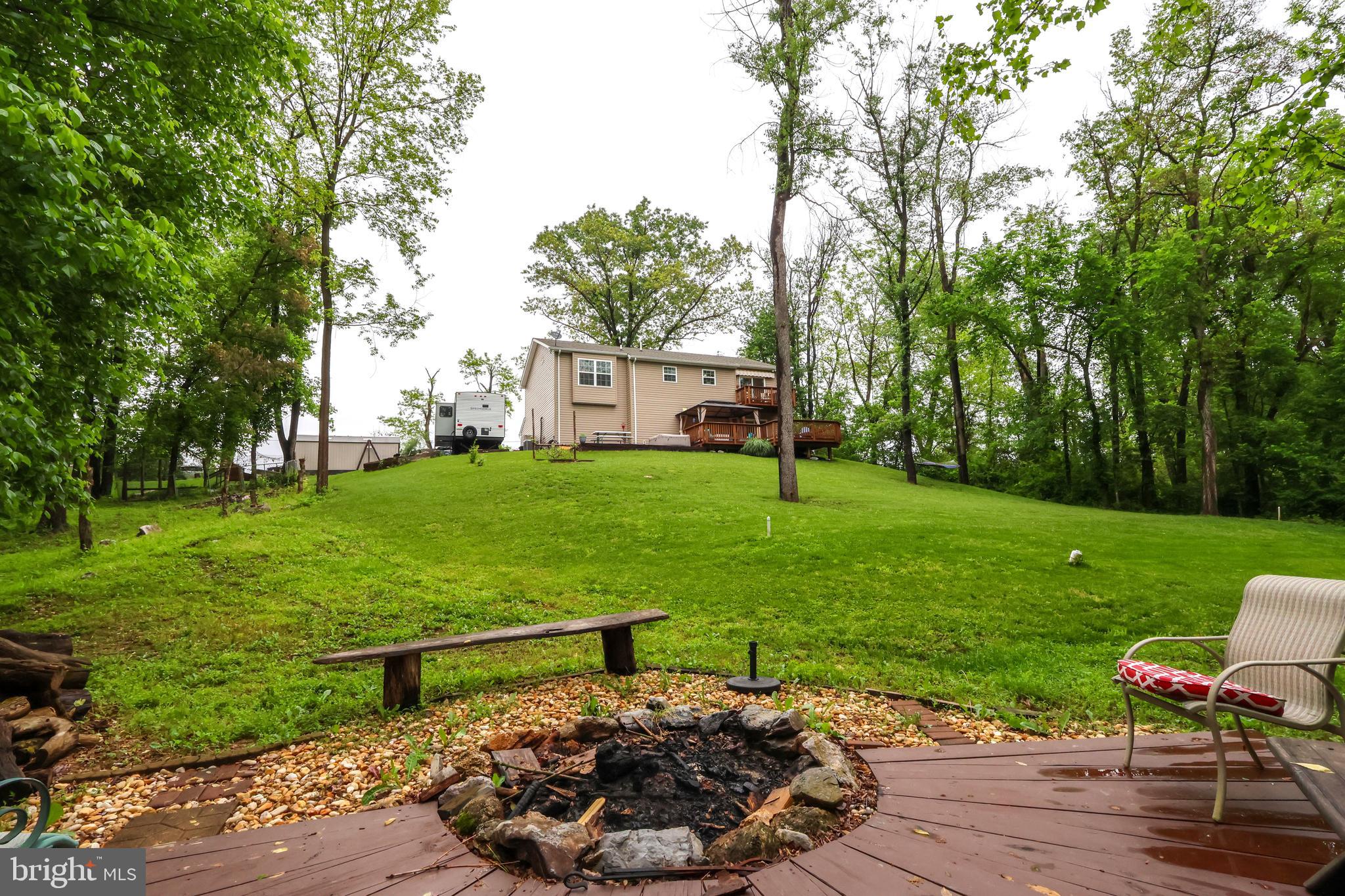 16919 Shaffer Road Sharpsburg, MD 21782 - Photo 50 of 58 a view of a house with a yard and sitting area