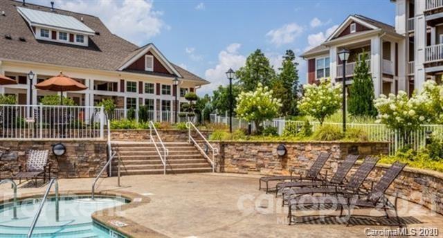 1555 Paddock Club Lane Fort Mill, SC 29715 - Photo 1 of 17 a front view of a house with a porch