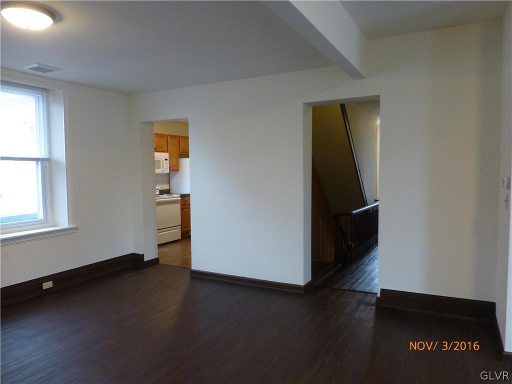 116 South Main Street Alburtis, PA 18011 - Photo 13 of 30 an empty room with wooden floor and windows