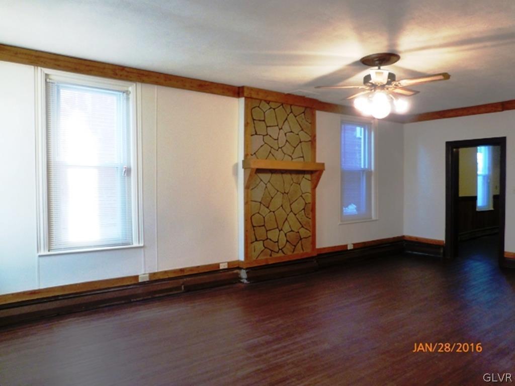 116 South Main Street Alburtis, PA 18011 - Photo 15 of 30 a view of an empty room with wooden floor and a window