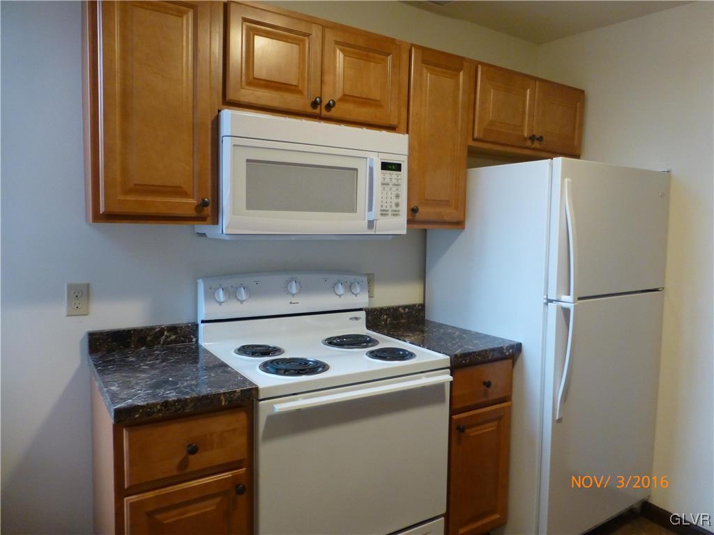 116 South Main Street Alburtis, PA 18011 - Photo 20 of 30 a kitchen with a stove and a refrigerator