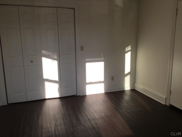 116 South Main Street Alburtis, PA 18011 - Photo 24 of 30 an empty room with wooden floor and windows