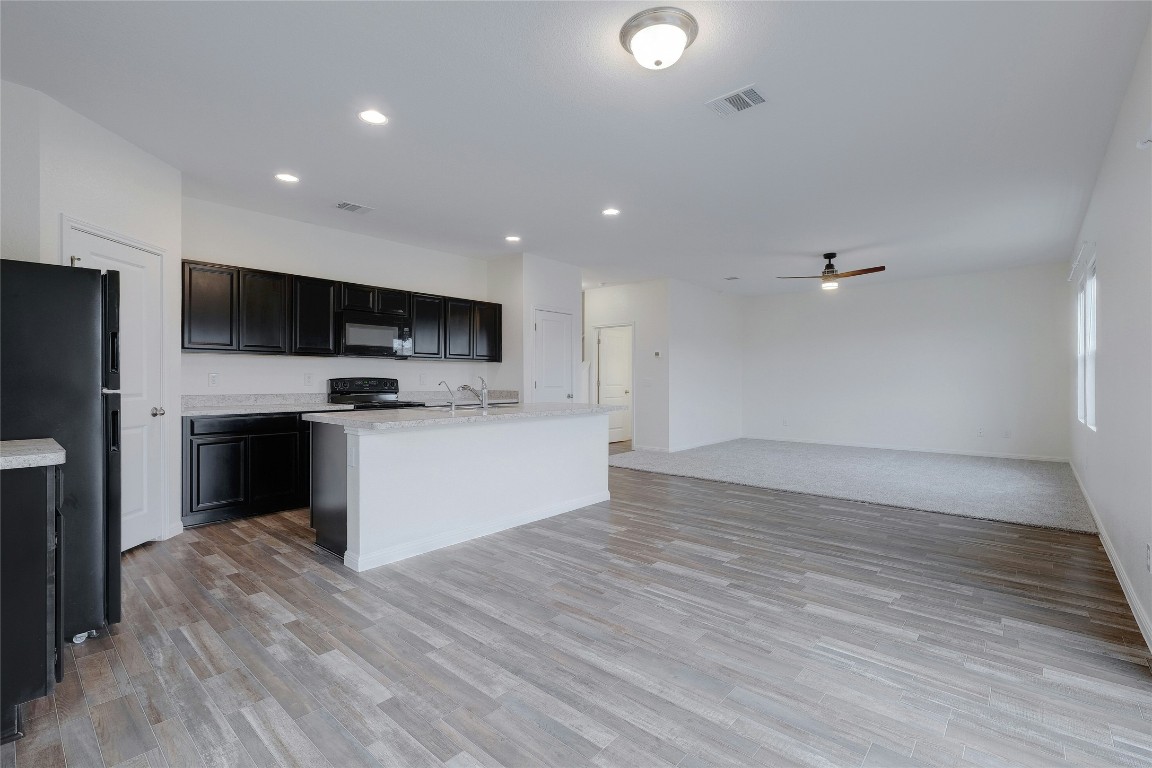 140 Satsuma Lane Kyle, TX 78640 - Photo 30 of 30 a view of kitchen with microwave and cabinets