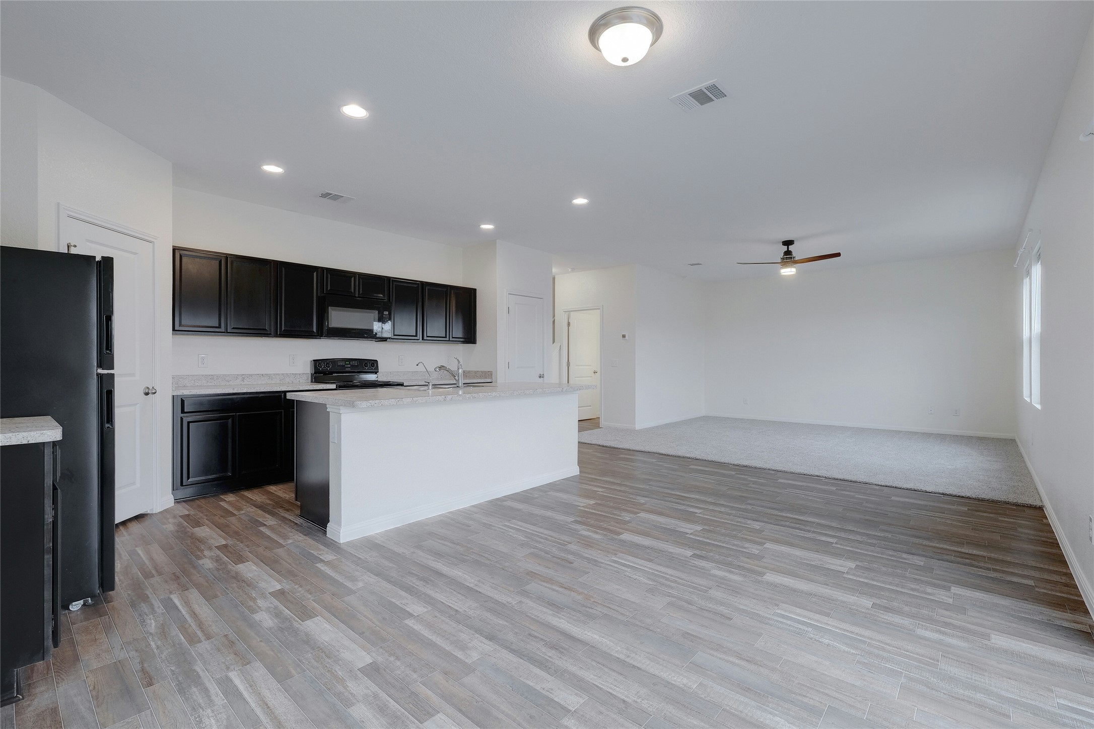 140 Satsuma Lane Kyle, TX 78640 - Photo 30 of 30 a view of kitchen with microwave and cabinets