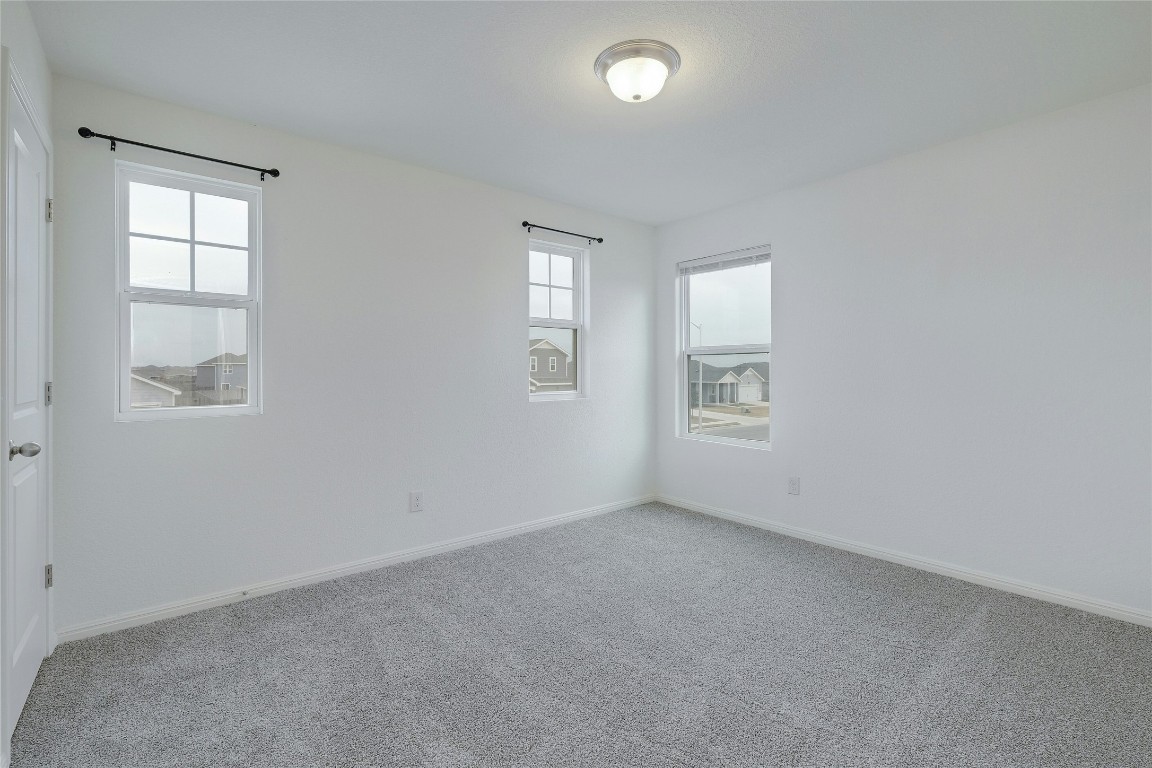 140 Satsuma Lane Kyle, TX 78640 - Photo 21 of 30 an empty room with windows