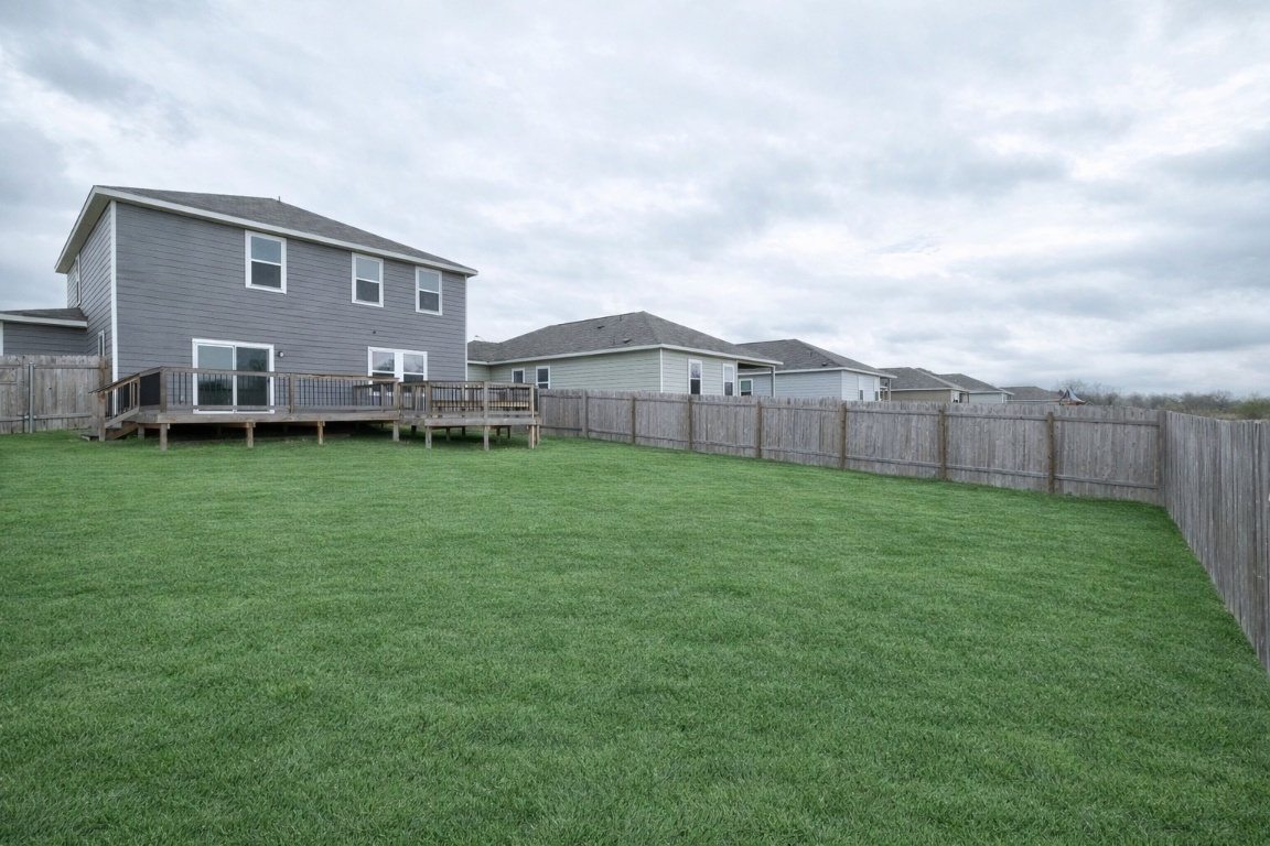 140 Satsuma Lane Kyle, TX 78640 - Photo 26 of 30 a view of a house with a yard and sitting area