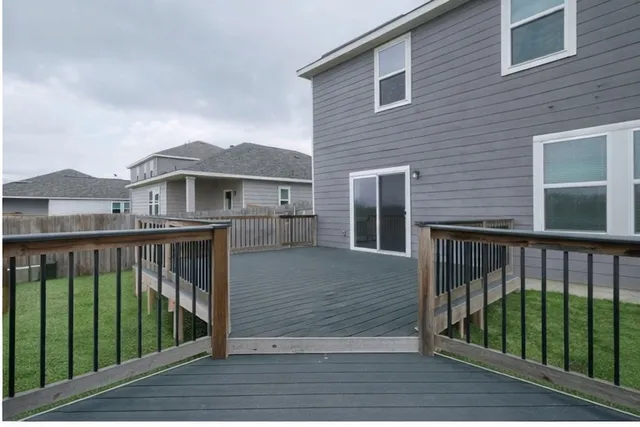 a view of balcony with deck and wooden floor