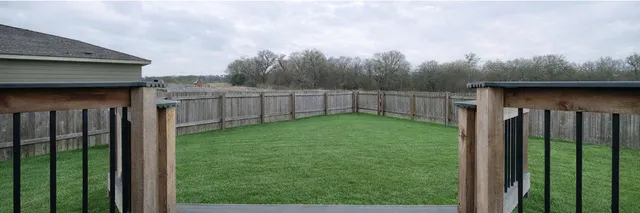 a view of a brick house with a balcony