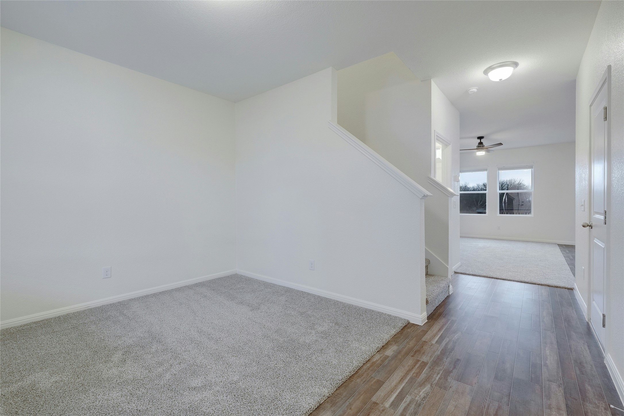 140 Satsuma Lane Kyle, TX 78640 - Photo 4 of 30 a view of a hallway with wooden floor