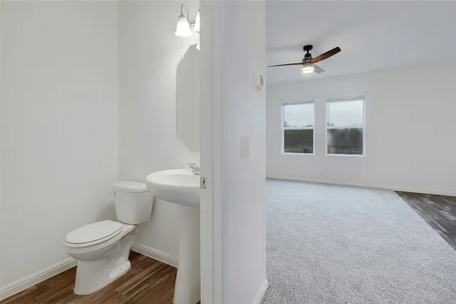 a bathroom with a toilet and a vanity