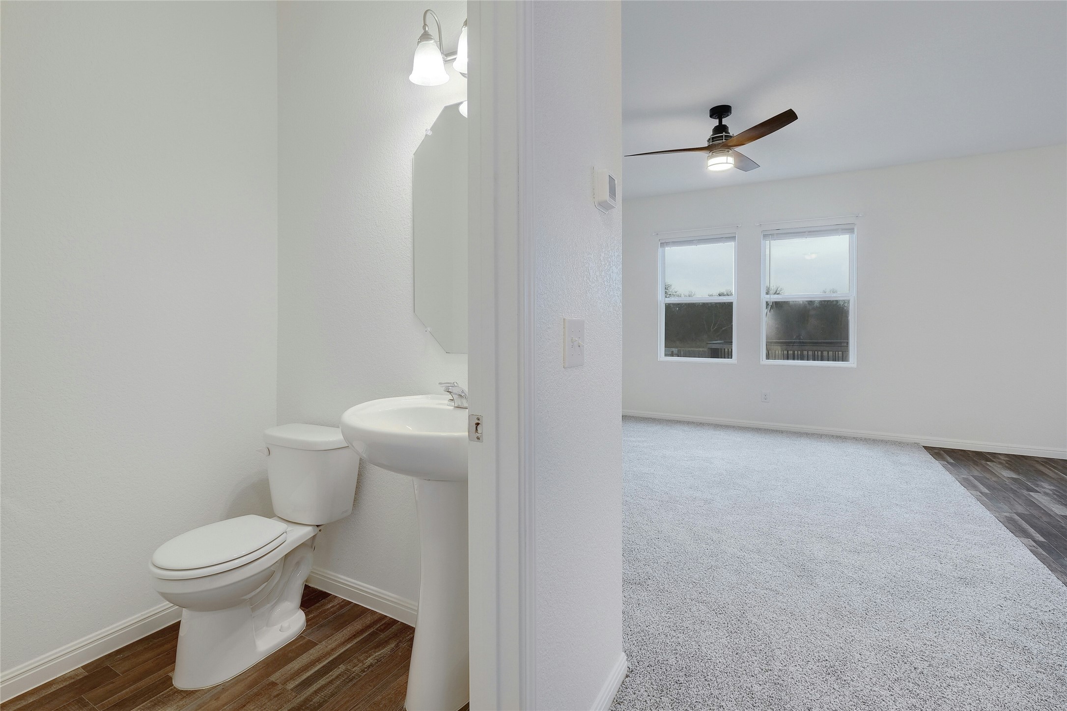 140 Satsuma Lane Kyle, TX 78640 - Photo 6 of 30 a bathroom with a toilet and a vanity