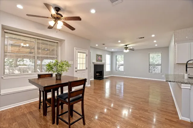 a view of a dining room with furniture window and wooden floor