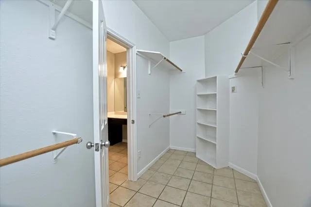 a view of an empty walk in closet