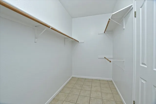 a view of an empty walk in closet