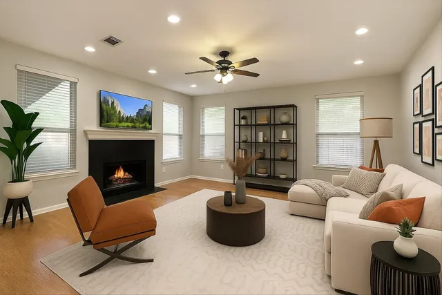 a living room with furniture and a fireplace