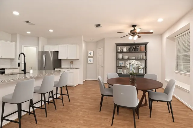 a view of a dining room with furniture window and wooden floor