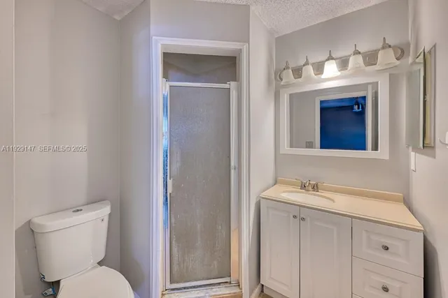 a bathroom with a sink a toilet and bathtub