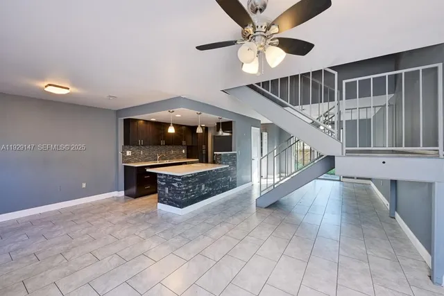 a view of an entryway with a floor to ceiling window