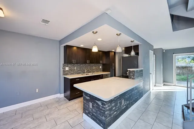 a view of a hallway view with staircase