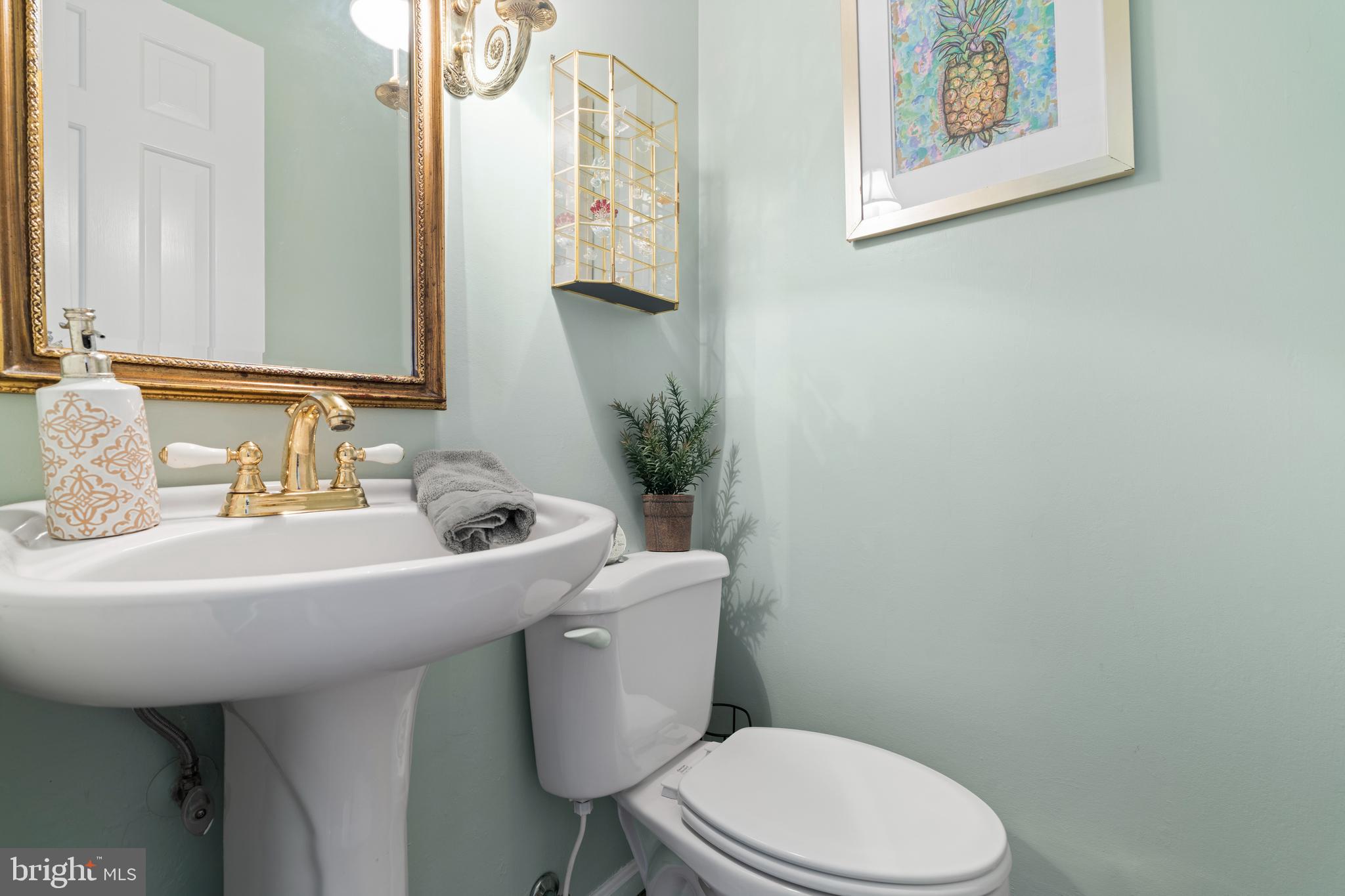 13714 Harcum Road Phoenix, MD 21131 - Photo 14 of 61 a bathroom with a sink mirror and toilet