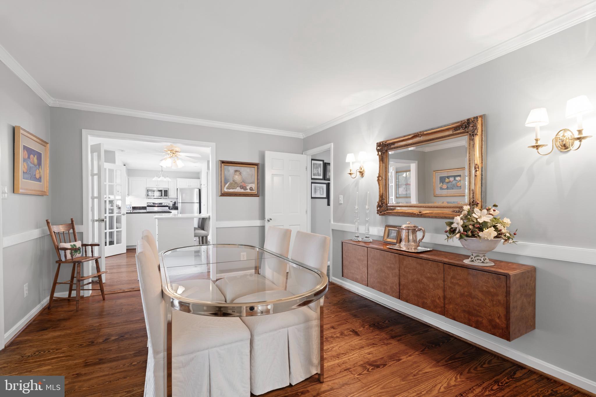13714 Harcum Road Phoenix, MD 21131 - Photo 16 of 61 a dining room with chandelier and wooden floor