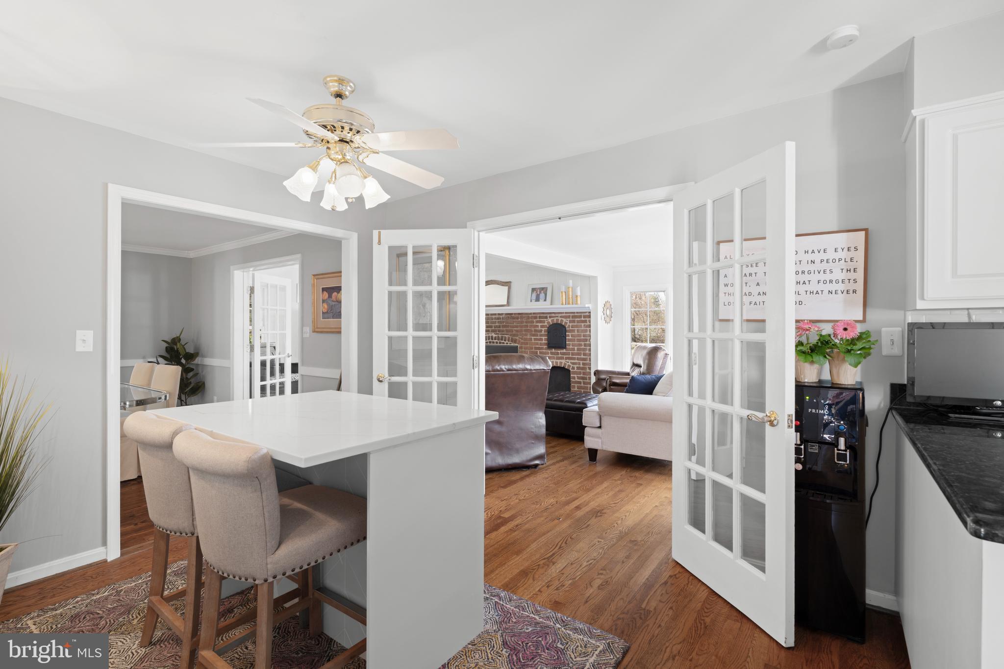 13714 Harcum Road Phoenix, MD 21131 - Photo 18 of 61 a view of a dining room with furniture and a kitchen