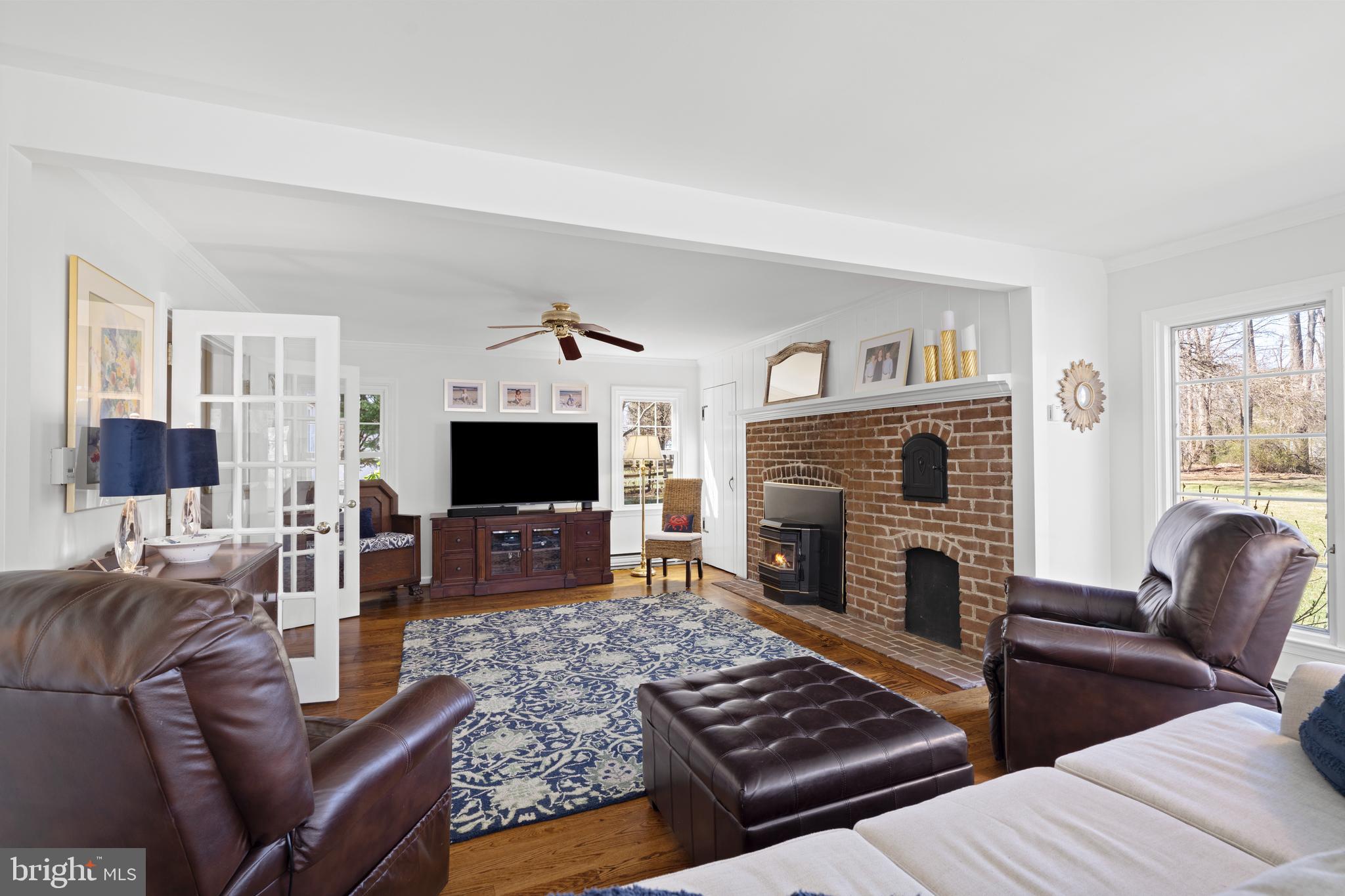 13714 Harcum Road Phoenix, MD 21131 - Photo 23 of 61 a living room with furniture and a fireplace