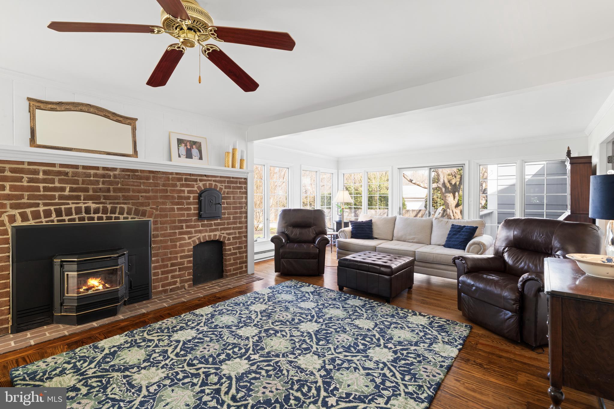 13714 Harcum Road Phoenix, MD 21131 - Photo 24 of 61 a living room with furniture and a fireplace