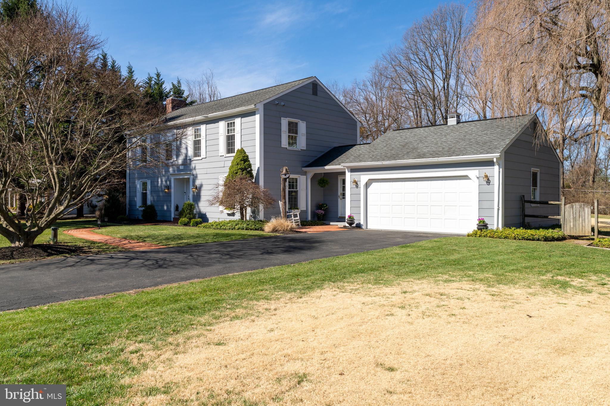 13714 Harcum Road Phoenix, MD 21131 - Photo 3 of 61 a front view of a house with a yard and garage