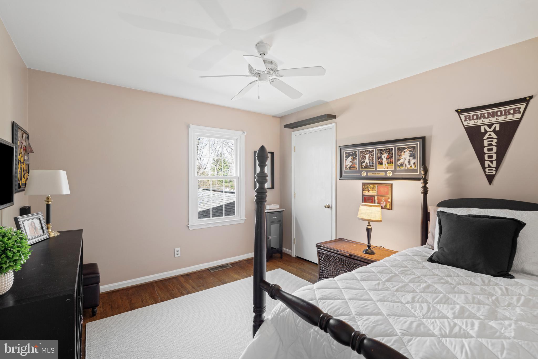 13714 Harcum Road Phoenix, MD 21131 - Photo 35 of 61 a bedroom with a bed and a flat screen tv