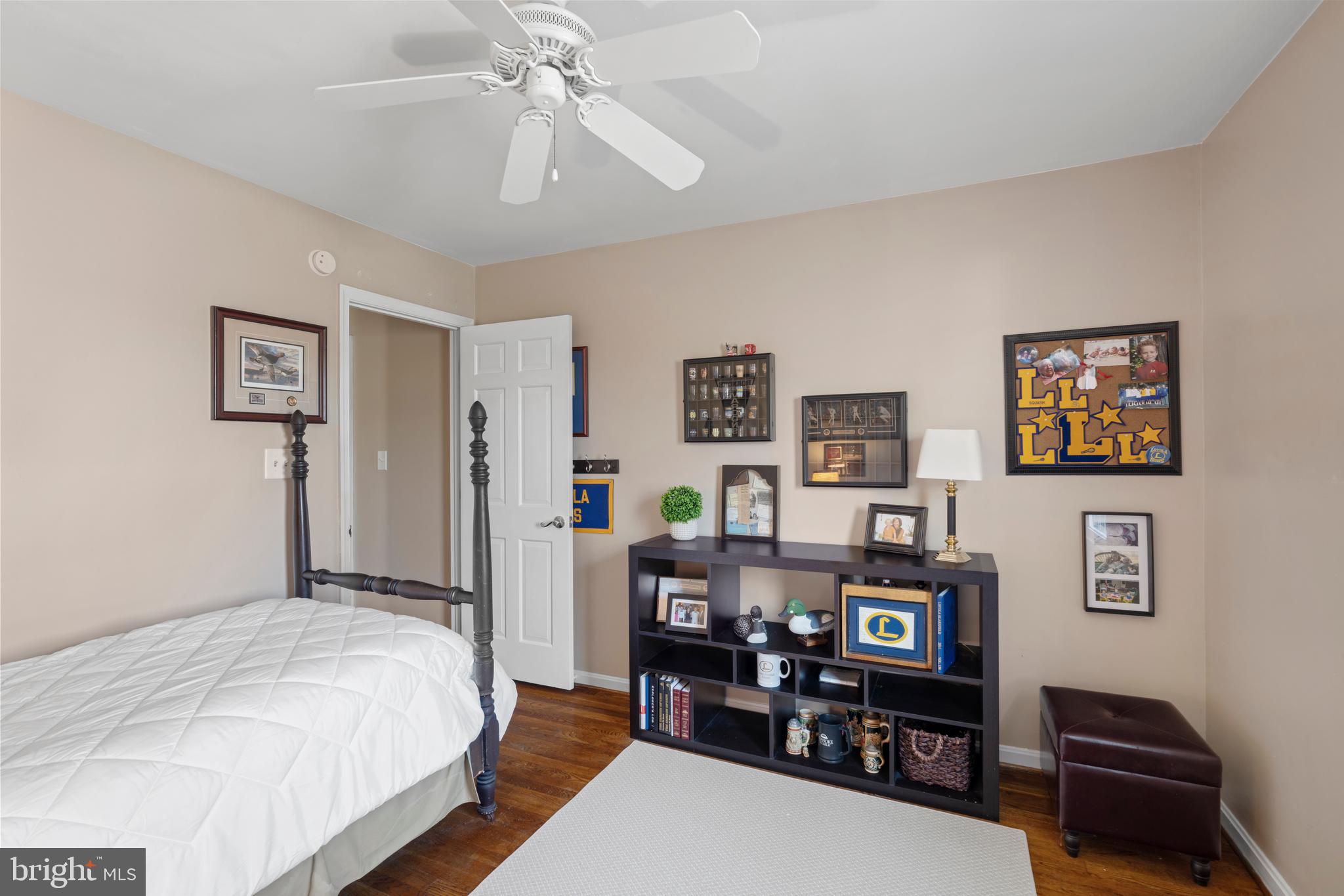 13714 Harcum Road Phoenix, MD 21131 - Photo 36 of 61 a bed room with a bed window and wall painting