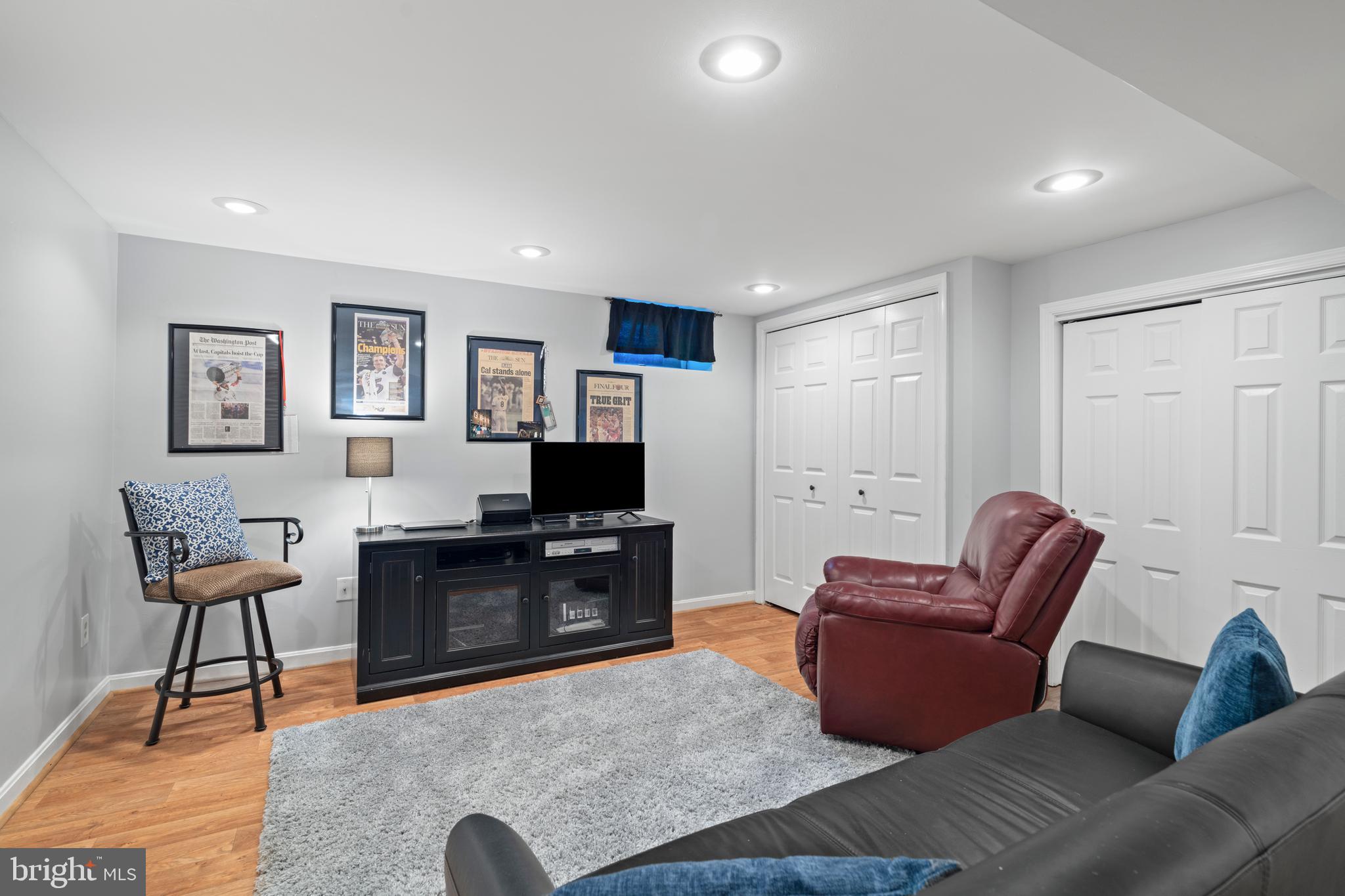 13714 Harcum Road Phoenix, MD 21131 - Photo 39 of 61 a living room with furniture a rug and a flat screen tv
