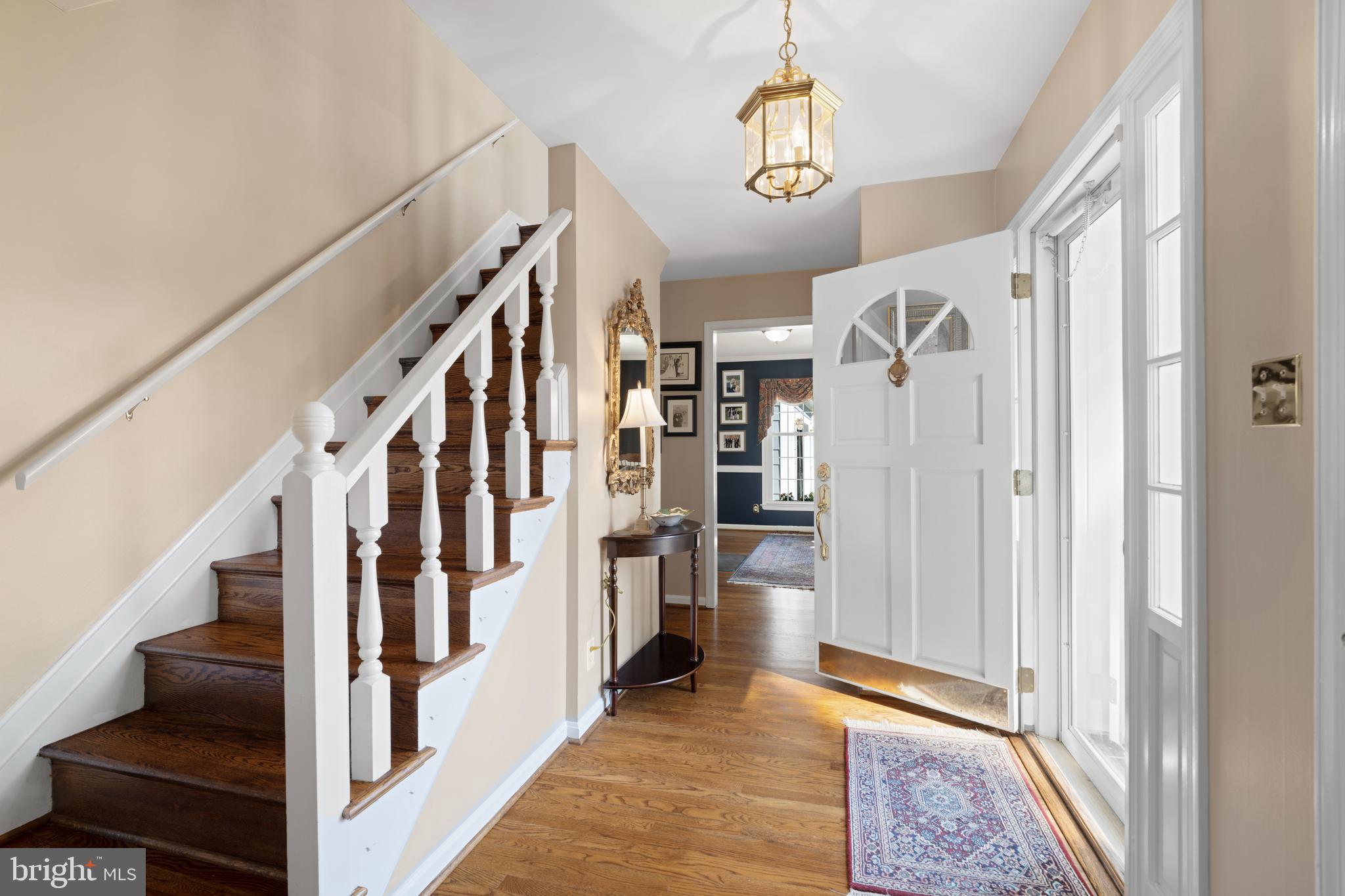13714 Harcum Road Phoenix, MD 21131 - Photo 8 of 61 a view of an entryway with wooden floor and stairs