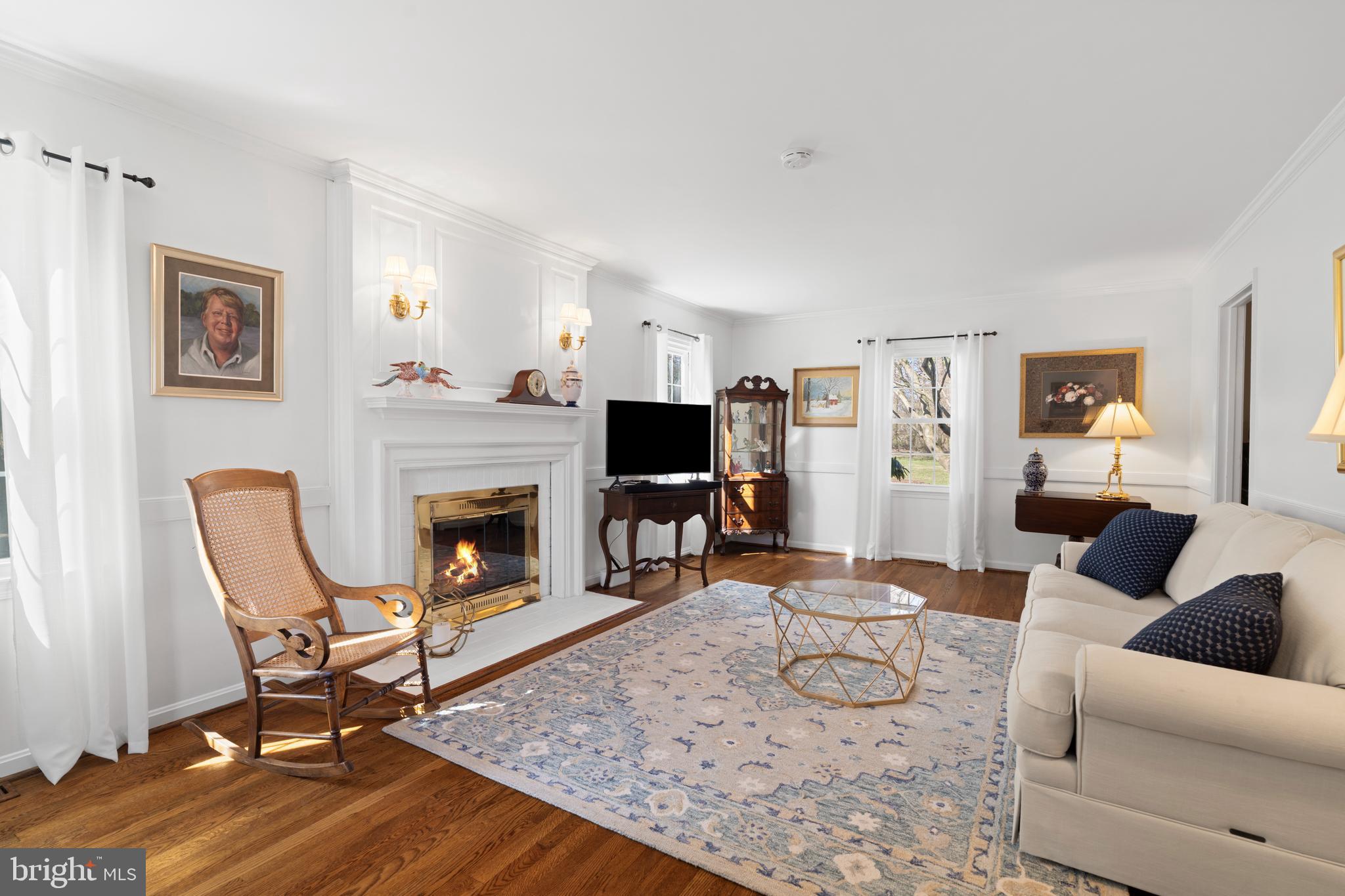 13714 Harcum Road Phoenix, MD 21131 - Photo 10 of 61 a living room with furniture and a fireplace