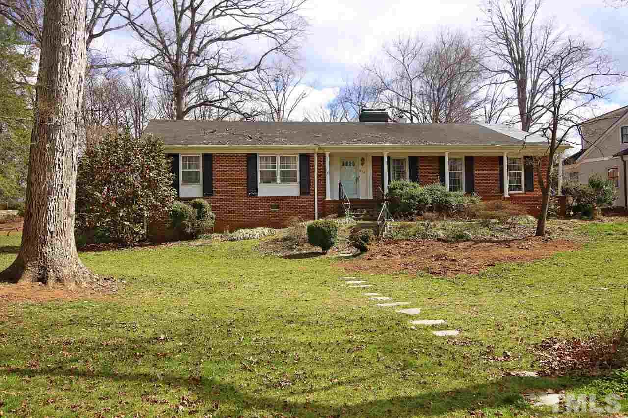 516 Chesterfield Road Raleigh, NC 27608 - Photo 1 of 21 a backyard of a house with yard table and chairs