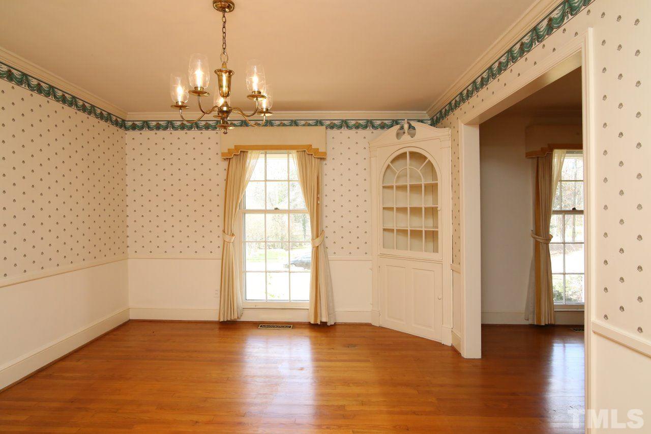 516 Chesterfield Road Raleigh, NC 27608 - Photo 7 of 21 a view of a livingroom with wooden floor and a window
