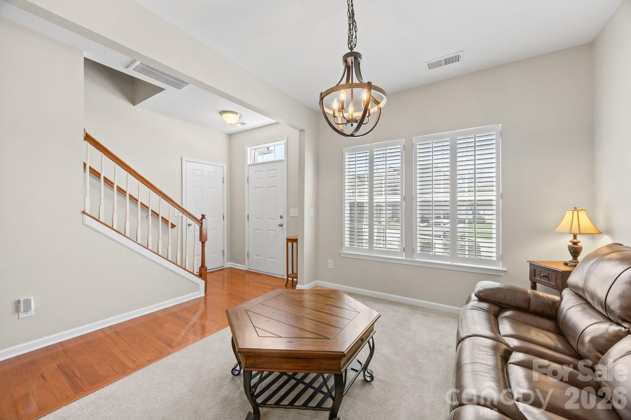 444 Battery Circle Clover, SC 29710 - Photo 8 of 22 a view of a livingroom with furniture window and wooden floor